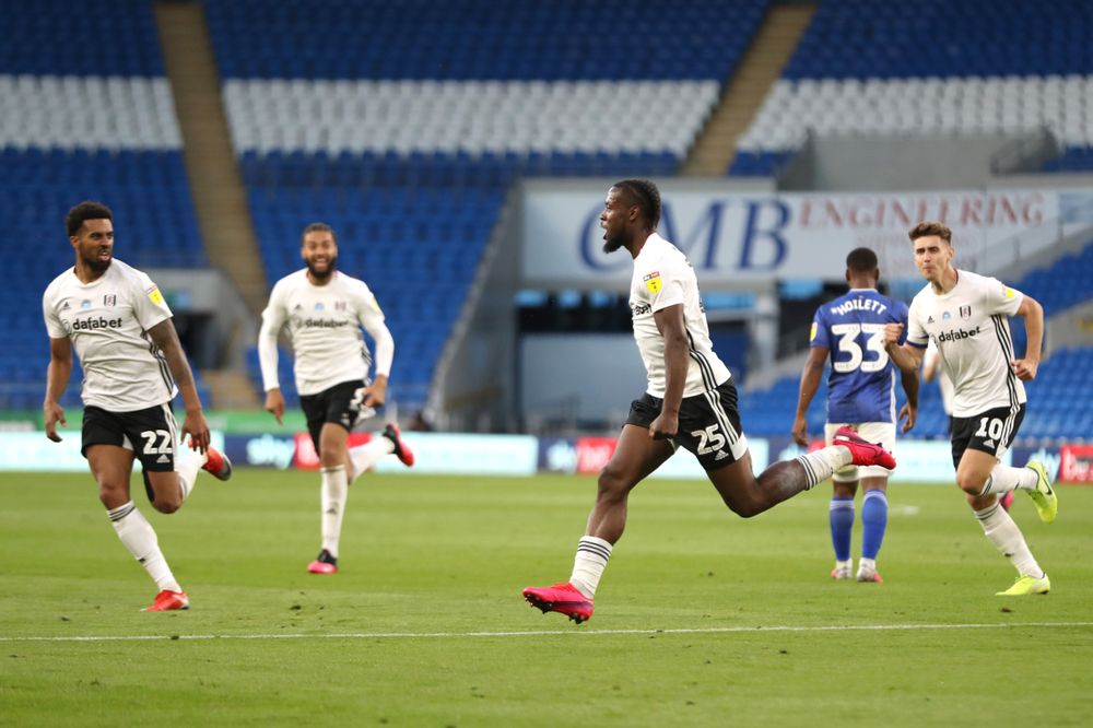 Josh Onomah celebrates scoring against Cardiff City
