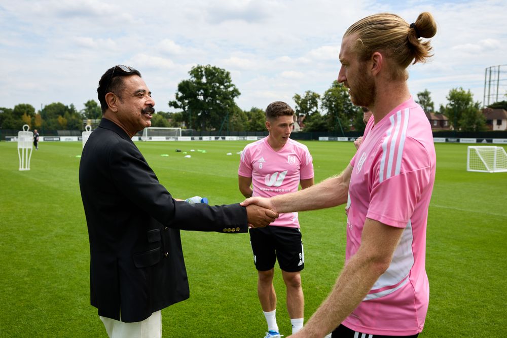 Mr Khan greets Tim Ream at training in July 2022 Mr Khan greets Tim Ream at training in July 2022