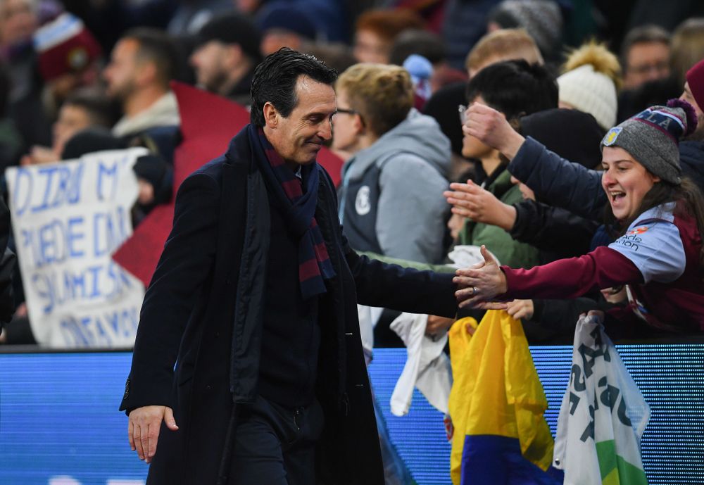 Unai Emery celebrates with fans Unai Emery celebrates with fans