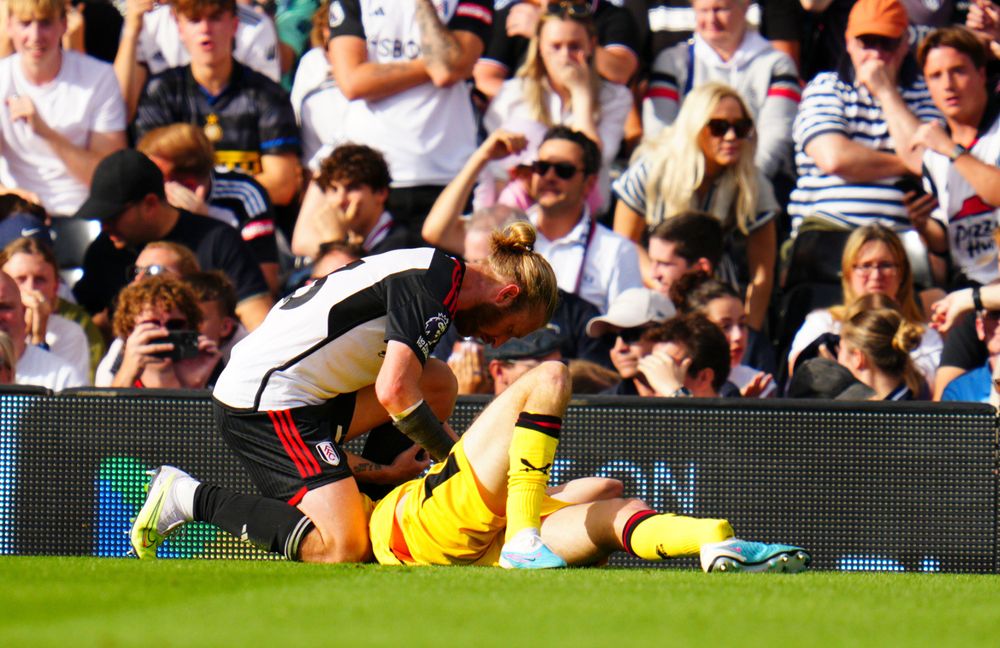 Tim Ream consoles Chris Basham Tim Ream consoles Chris Basham