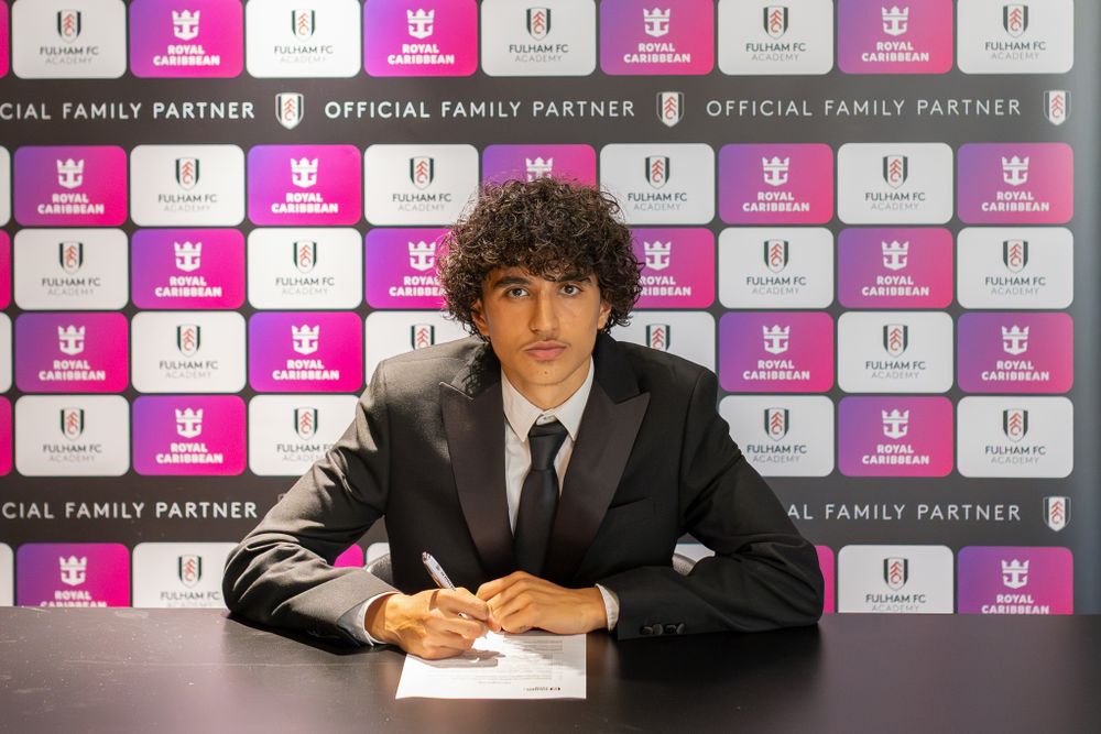 Anand Batra signs his scholarship agreement