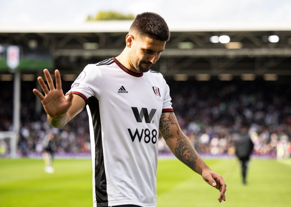 Aleksandar Mitrović makes his way off the pitch after picking up an injury