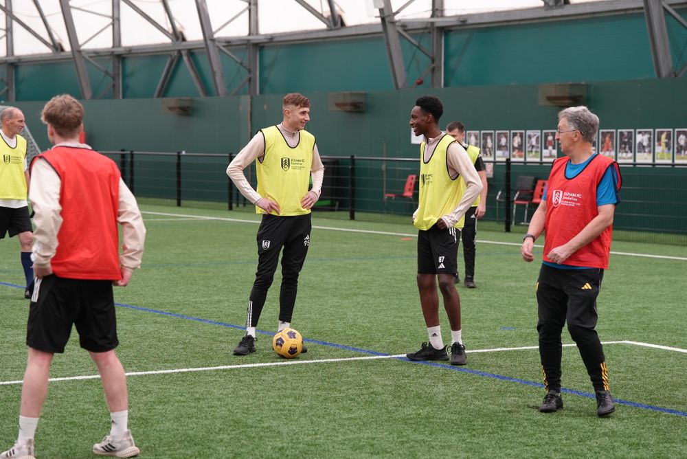 Walking football participants with Academy players Walking football participants with Academy players