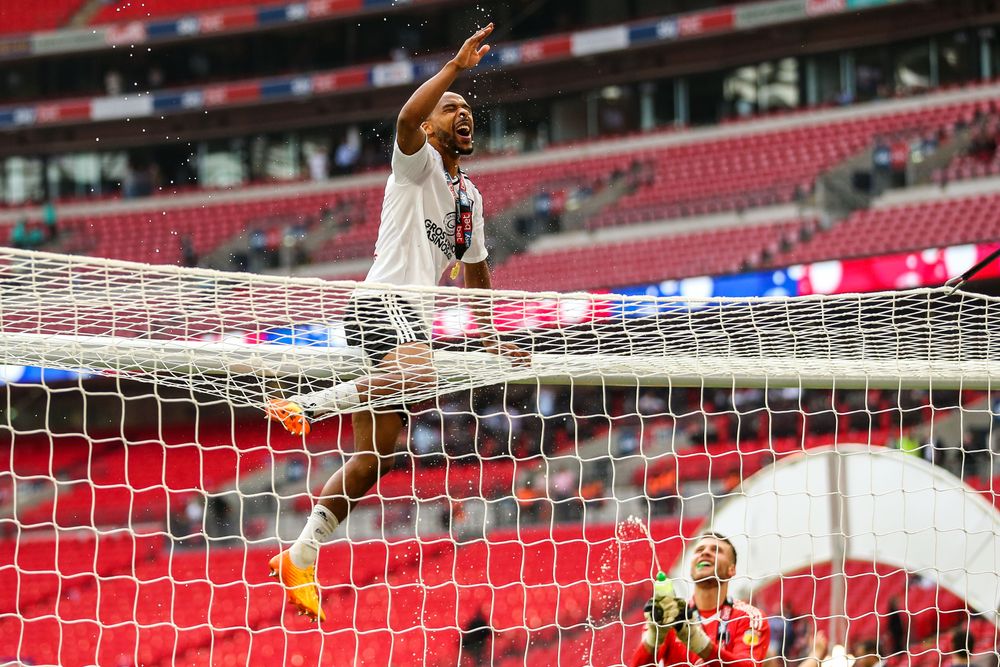Denis Odoi celebrates on the crossbar at Wembley Denis Odoi celebrates on the crossbar at Wembley