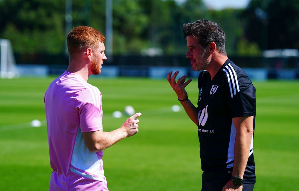 Harrison Reed chats to Marco Silva during training