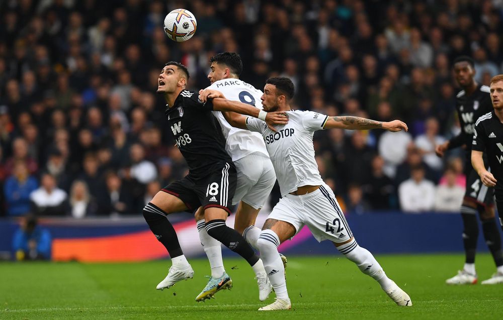 Andreas holds off two Leeds players