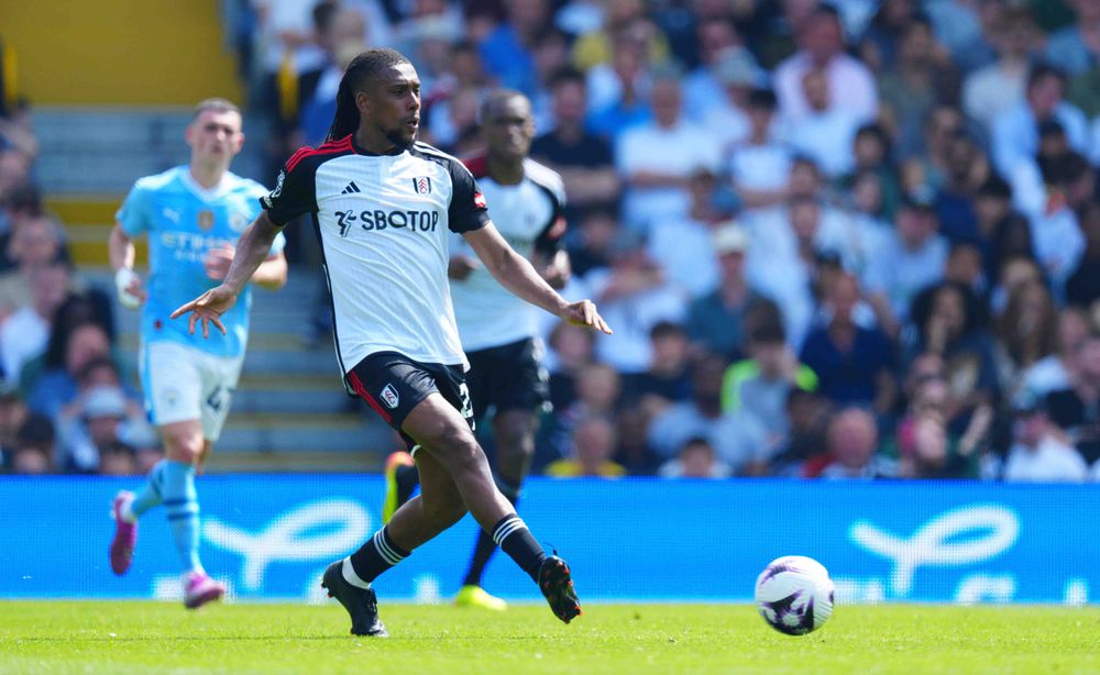 Alex Iwobi in action against Manchester City Alex Iwobi in action against Manchester City