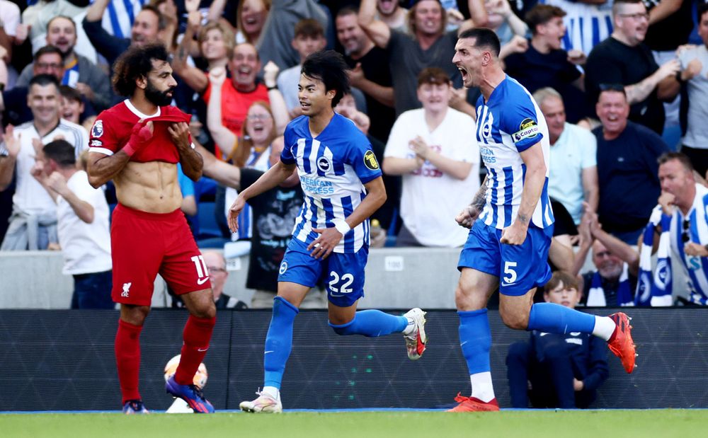 Lewis Dunk celebrates scoring against Liverpool