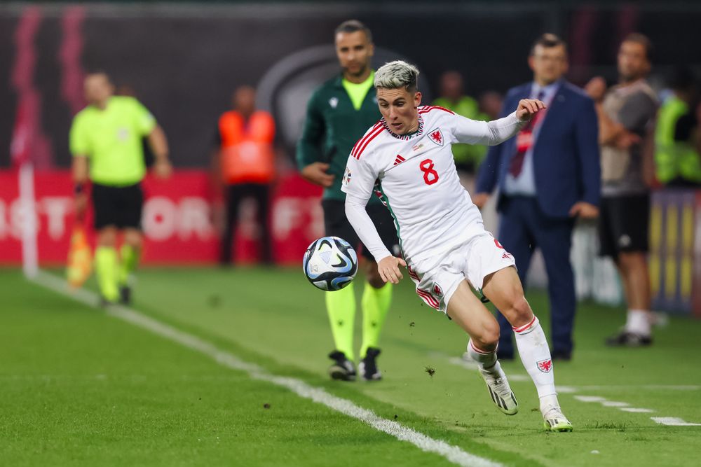 Harry Wilson does well to keep the ball in on his way to setting up David Brooks. (Photo courtesy of FAW)