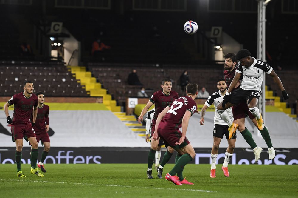 Josh Maja leaps highest under challenge.