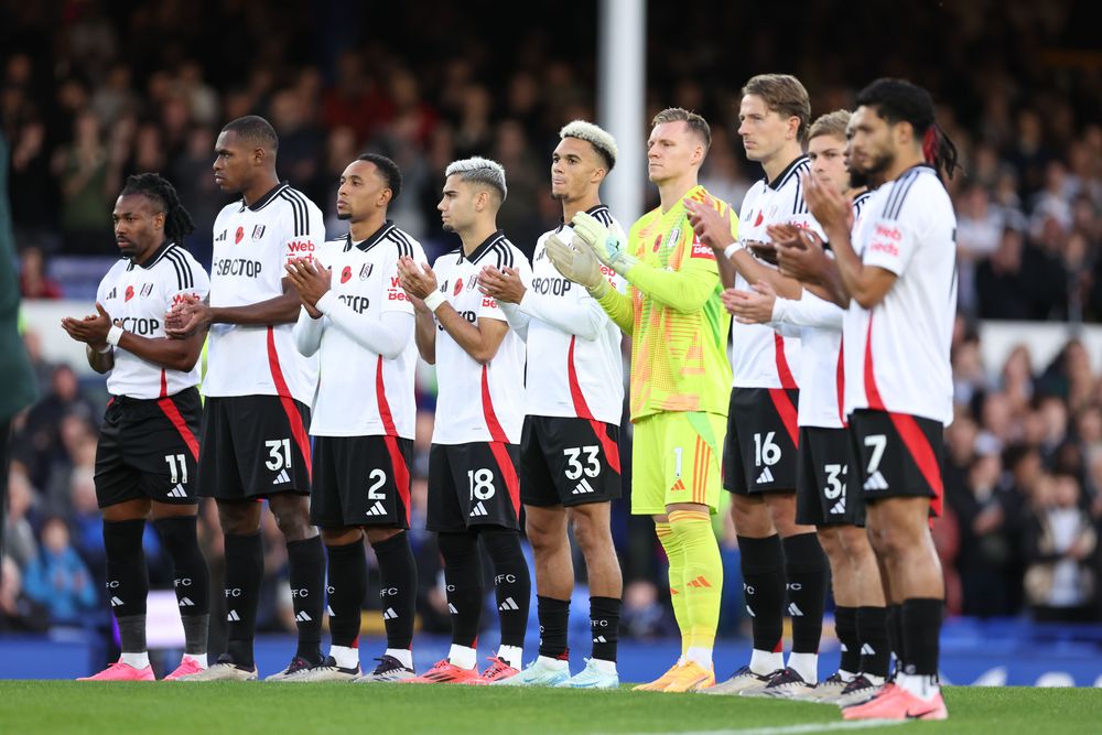 The Fulham team line up while The Last Post is played The Fulham team line up while The Last Post is played