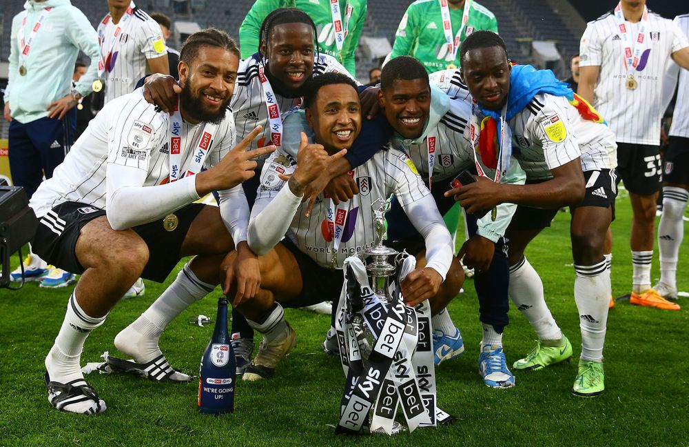 Michael Hector celebrates winning the Championship with Josh Onomah, Kenny Tete, Ivan Cavaleiro and Neeskens Kebano