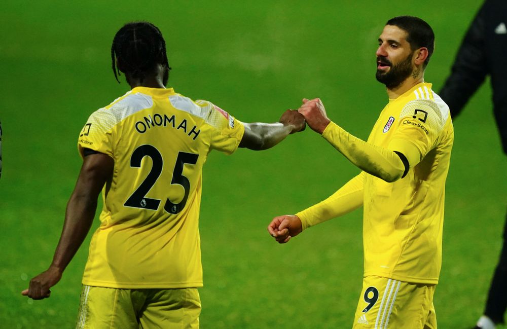 Josh Onomah and Aleksandar Mitrović celebrate against QPR