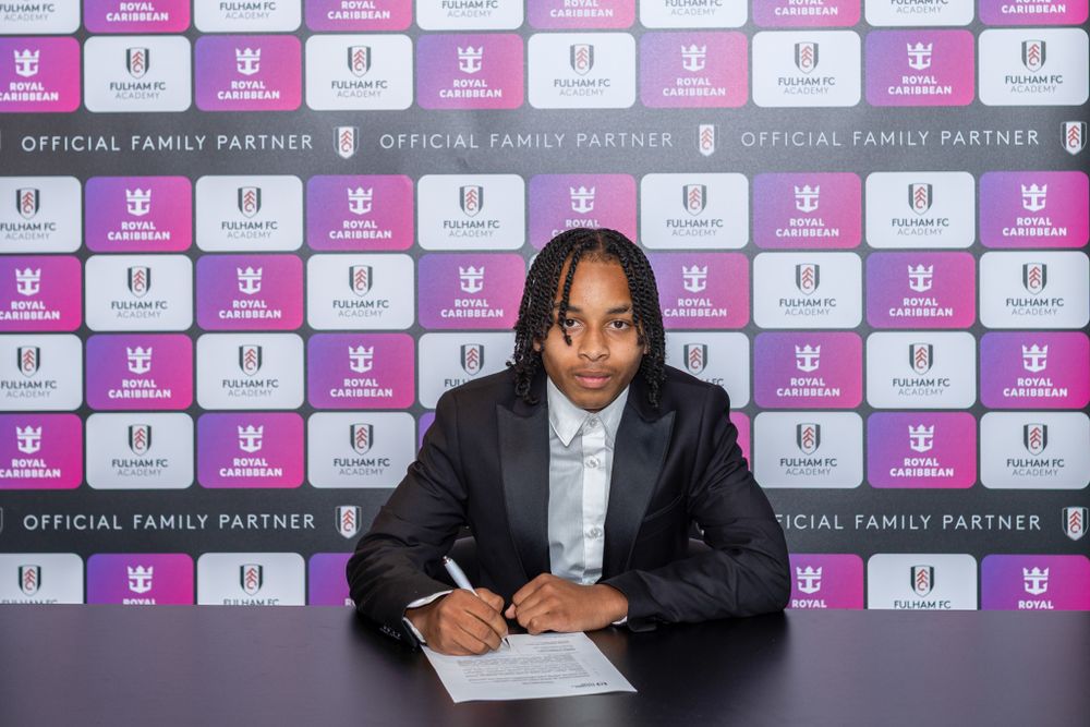 Dylan De-Gale signs his scholarship agreement