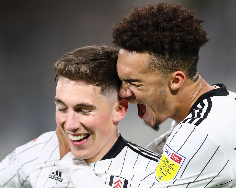 Harry Wilson celebrates with Antonee Robinson