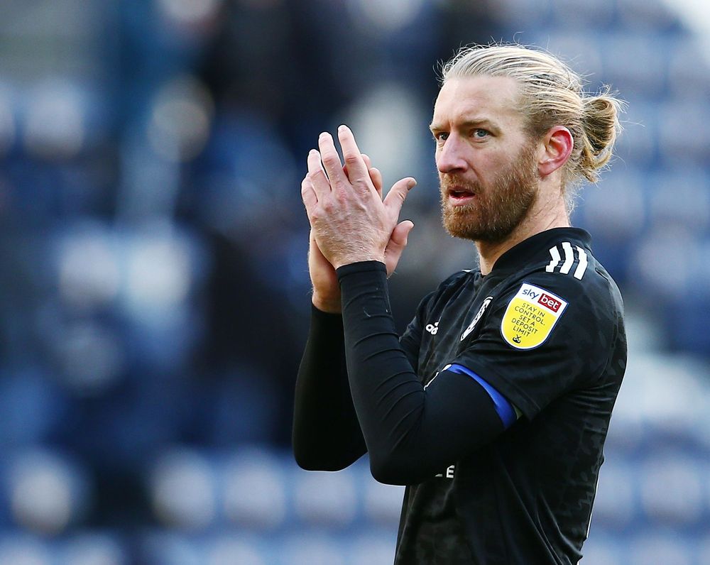Tim Ream applauds the Fulham fans at full-time