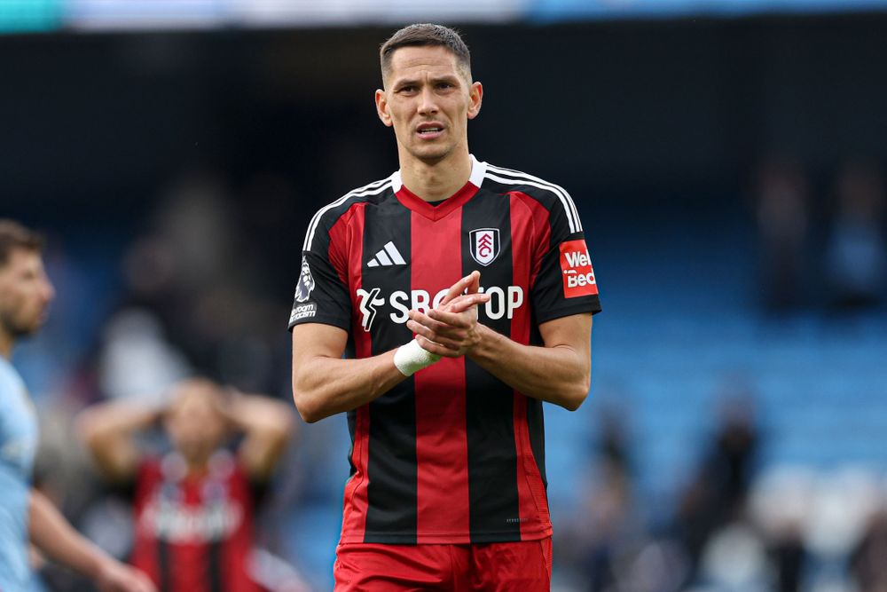 Saša Lukić claps the Fulham fans after defeat to Manchester City