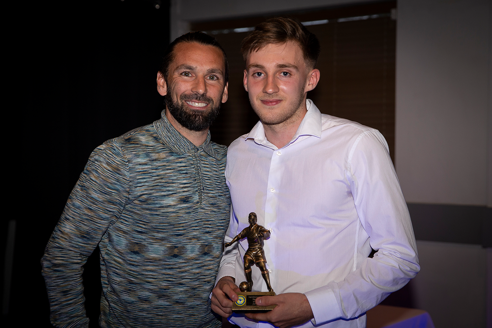 Page poses with one of his awards