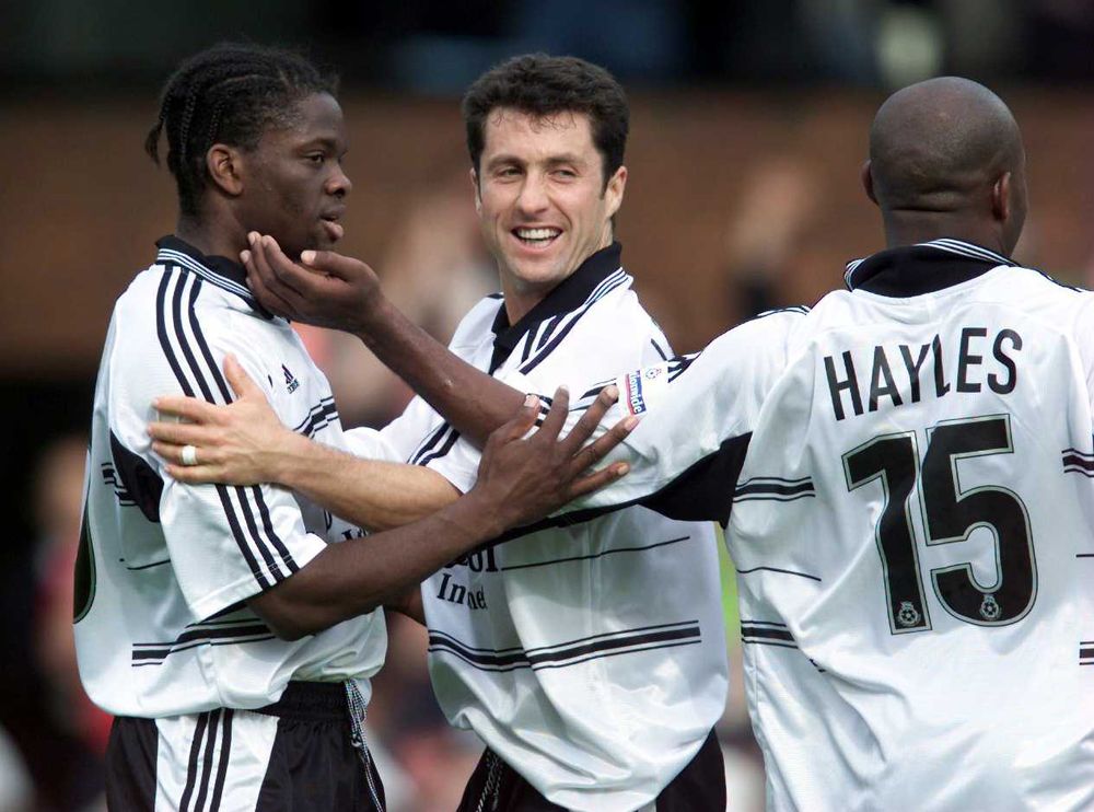 Louis Saha celebrates with John Collins and Barry Hayles Louis Saha celebrates with John Collins and Barry Hayles