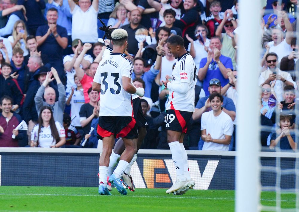 Reiss Nelson celebrates scoring against Newcastle with Antonee Robinson and Calvin Bassey