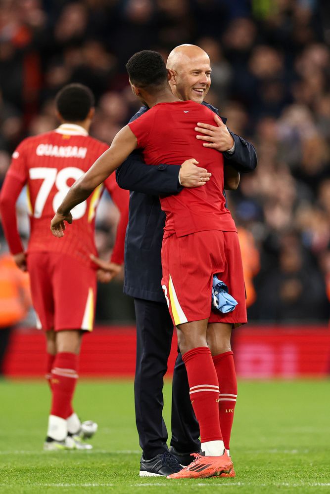 Arne Slot celebrates with Cody Gakpo after defeating Manchester City