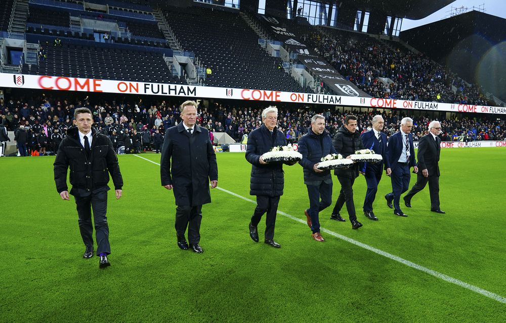 Flowers are laid in tribute to George Cohen