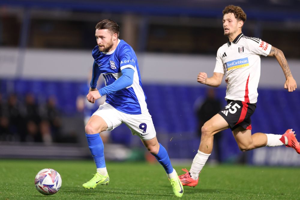 Alfie May of Birmingham City runs away from Ollie Gofford
