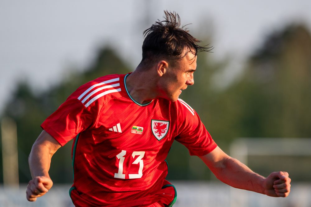 Luke Harris celebrates scoring for Wales U21s. (Photo courtesy of  FAW)