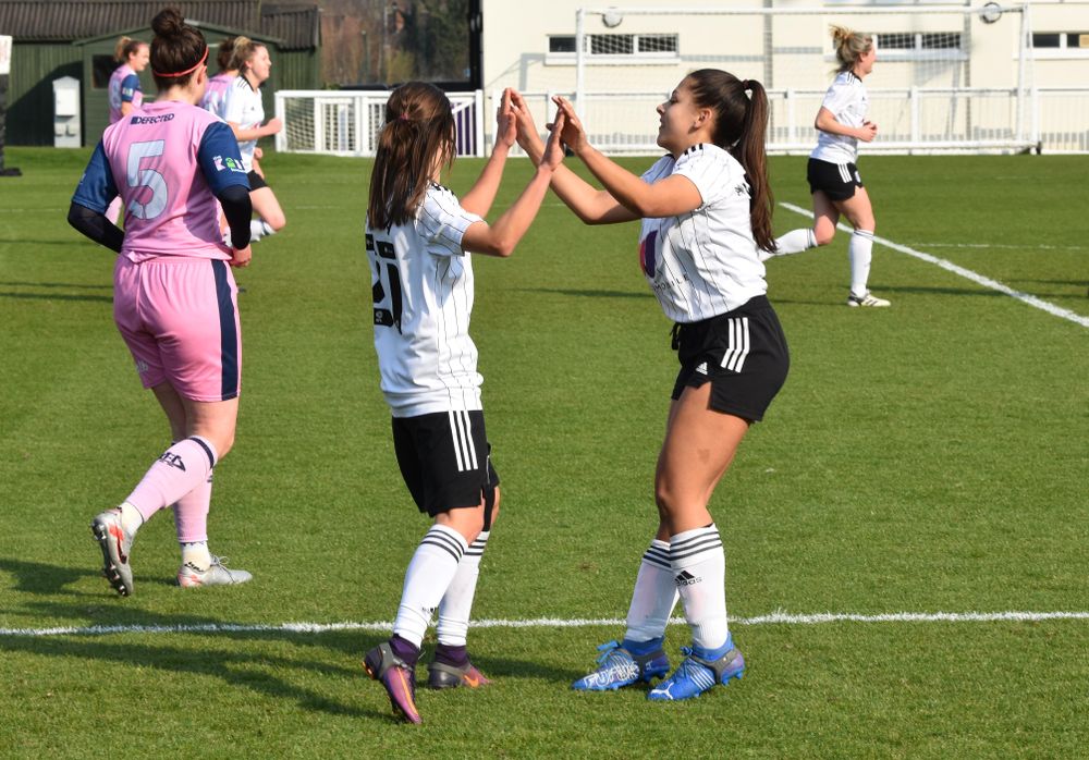 Lilly Lambird and Oana Negrea celebrate the equaliser 
