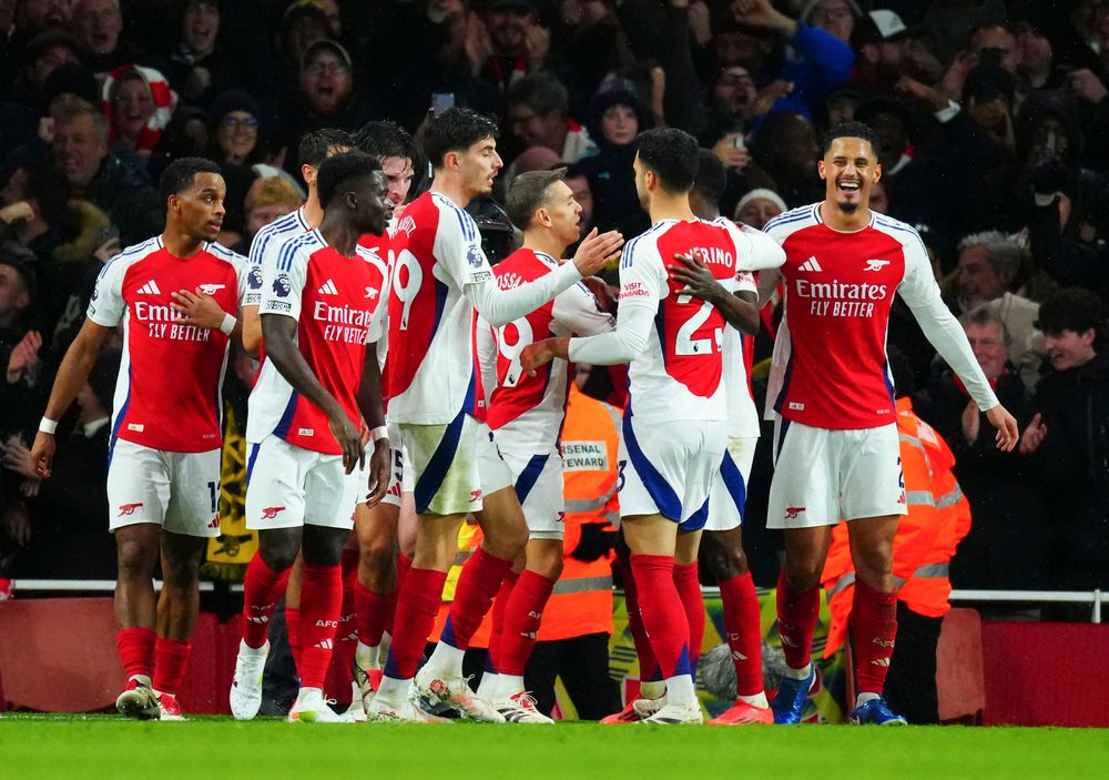 Arsenal players celebrate their second goal against Manchester United