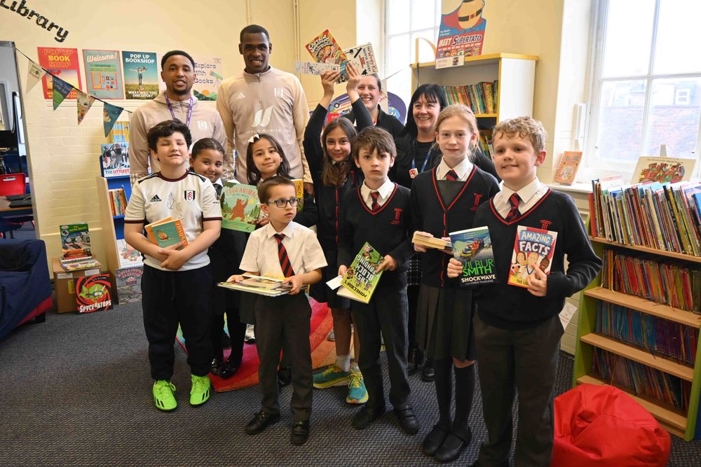 Kenny Tete and Issa Diop pose with students Kenny Tete and Issa Diop pose with students