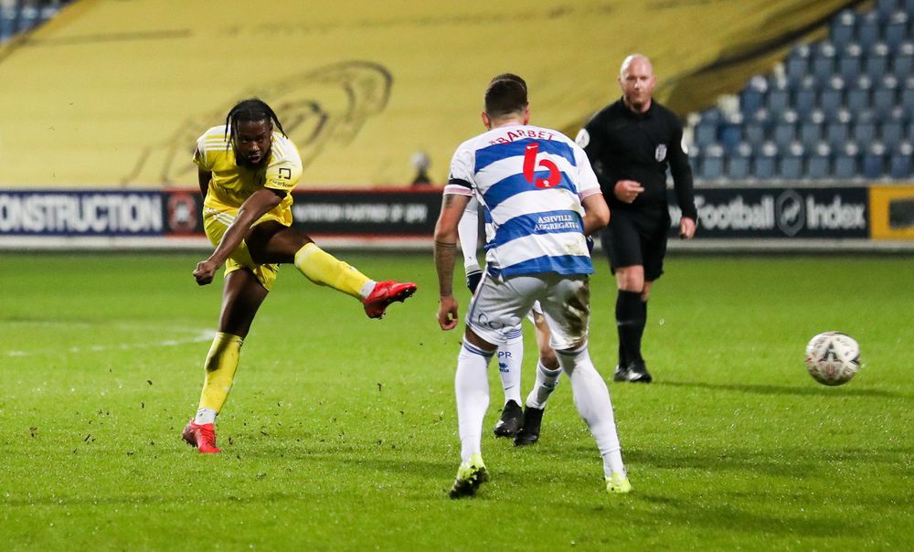 Josh Onomah tries his luck from distance against QPR