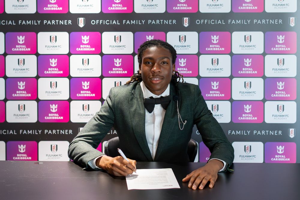Kymarley Morrison signs his scholarship agreement