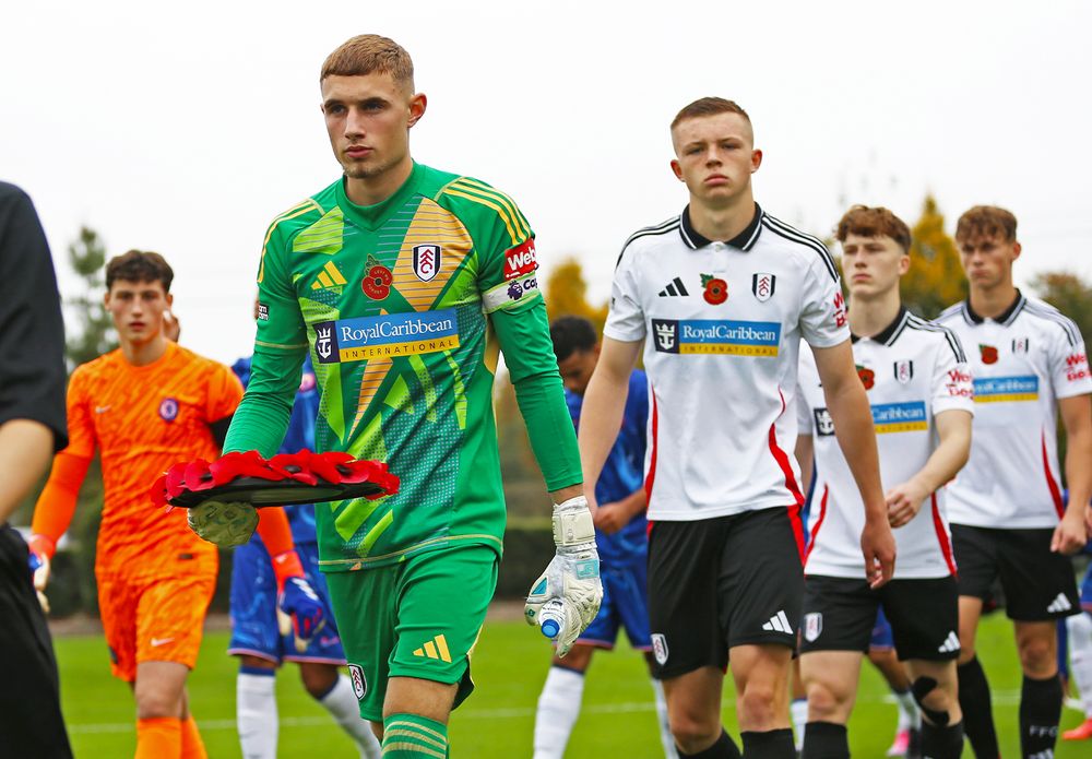 Marco Underwood leads Fulham Under-18s out against Chelsea