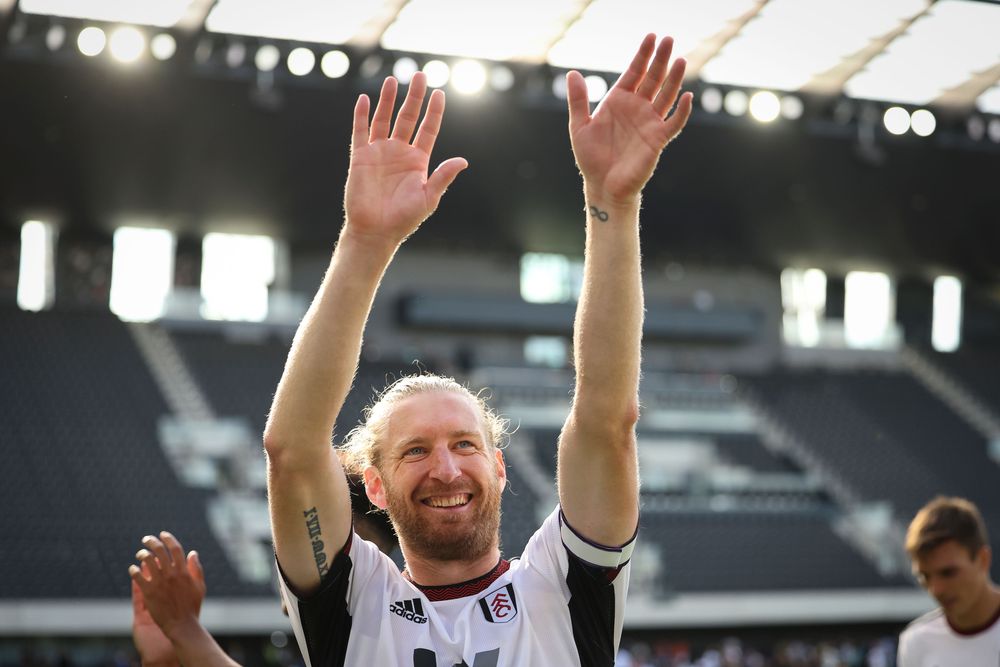 Tim Ream waves to fans following Fulham's victory over Brentford in August 2022 Tim Ream waves to fans following Fulham's victory over Brentford in August 2022