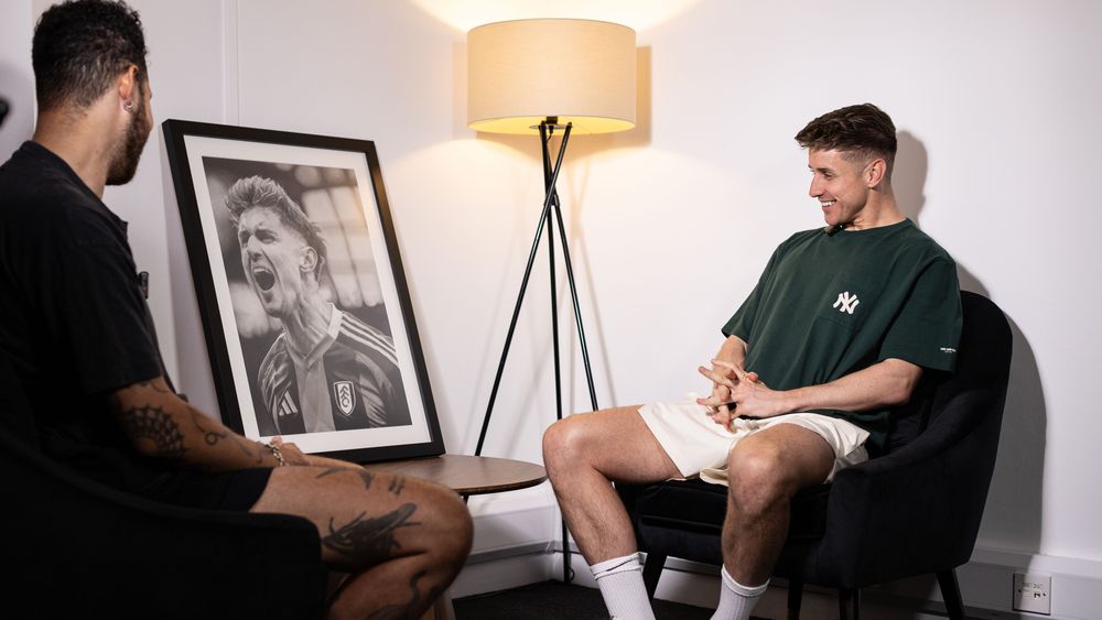 Tom Cairney smiles as he is presented with a bespoke portrait Tom Cairney smiles as he is presented with a bespoke portrait