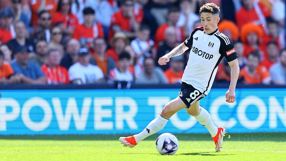 Fulham forward Harry Wilson dribbles will the ball against Luton Town