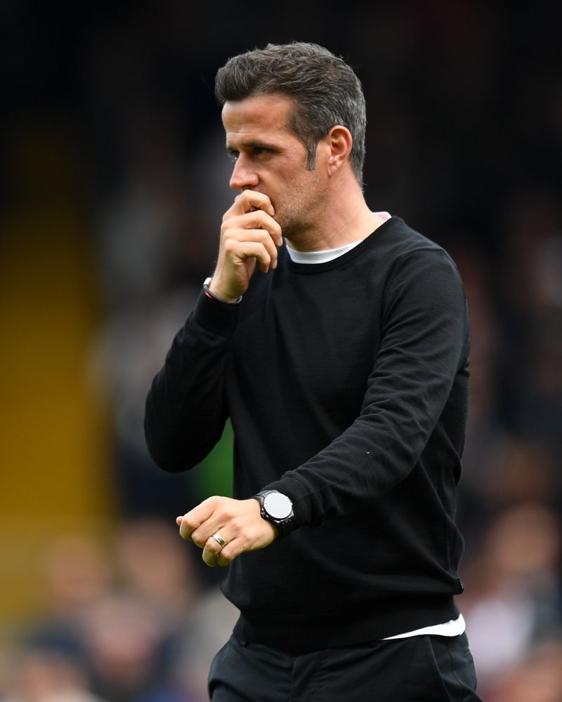 Marco Silva walks across the pitch