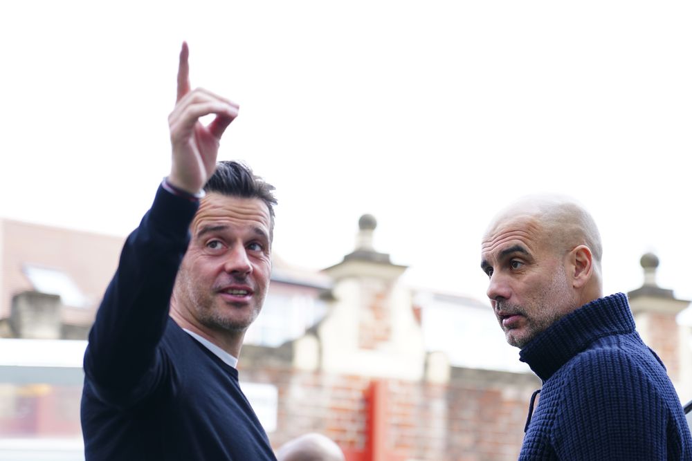 Marco Silva chats with Pep Guardiola pre-match