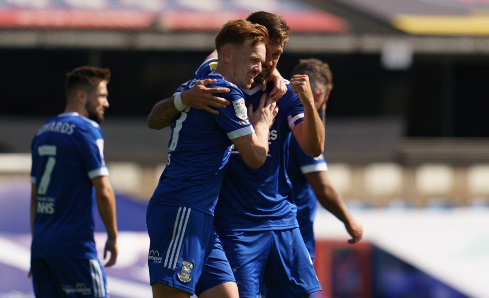Ipswich players celebrate a goal against Wigan