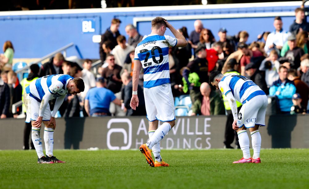 QPR's players after their defeat by Peterborough QPR's players after their defeat by Peterborough