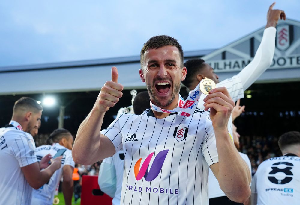 Joe Bryan celebrates with his Champions medal