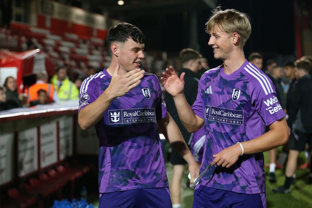 Chris Donnell and Luc de Fougerolles celebrate after Fulham U21s' win at Tottenham