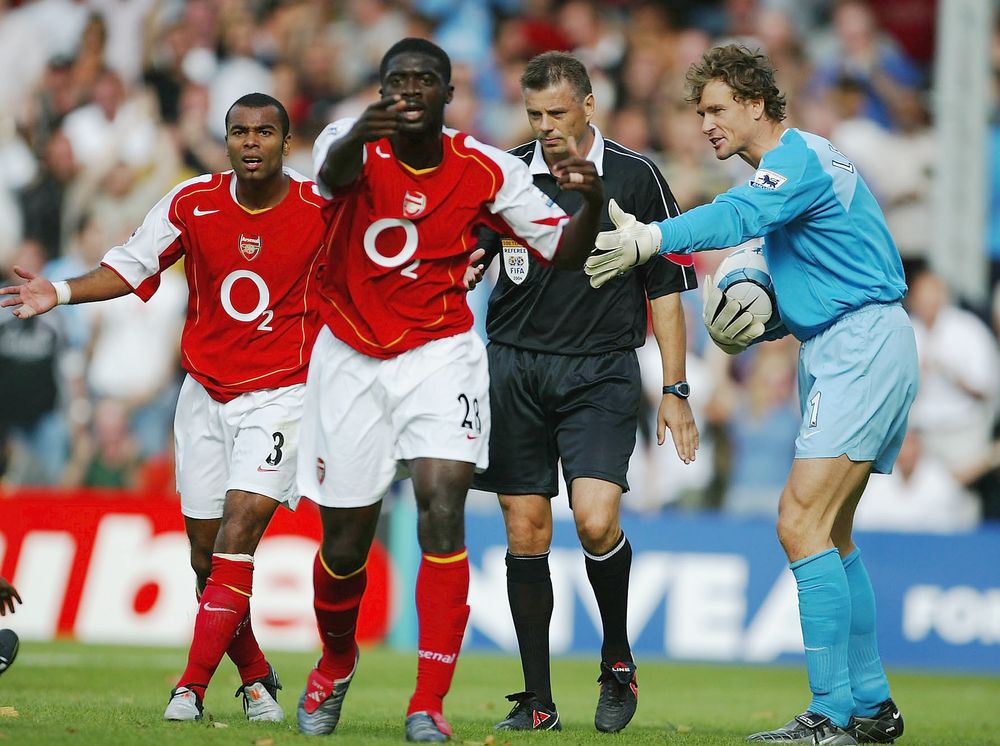 Arsenal's players protest the decision to award Fulham a penalty Arsenal's players protest the decision to award Fulham a penalty