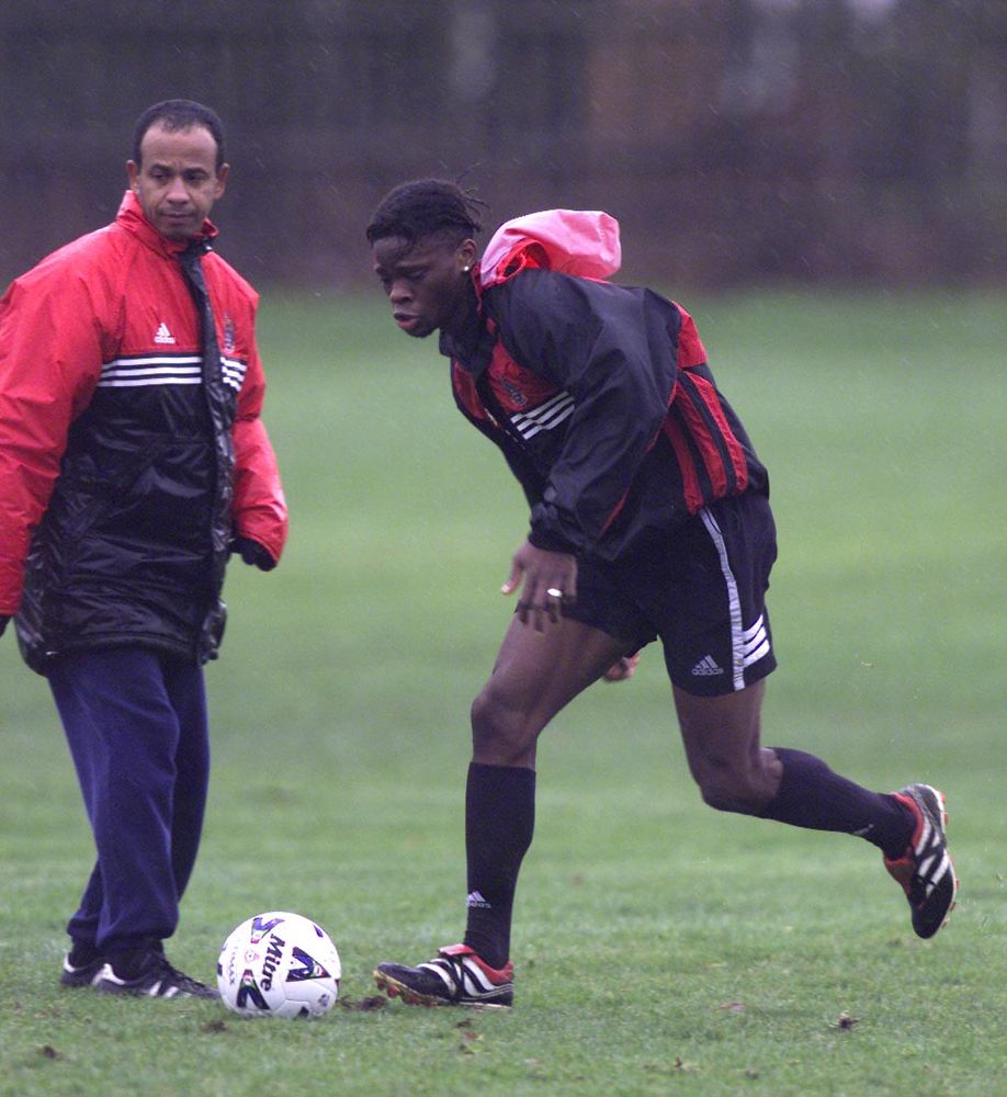 Jean Tigana observes Louis Saha in training Jean Tigana observes Louis Saha in training