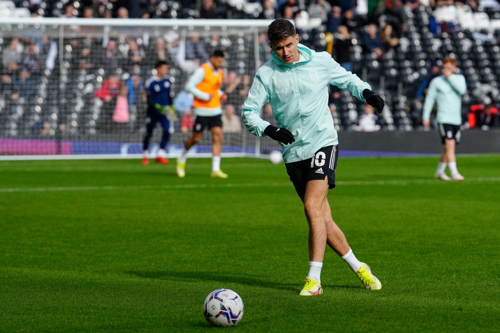 Tom Cairney warms up ahead of Fulham's meeting with QPR Tom Cairney warms up ahead of Fulham's meeting with QPR
