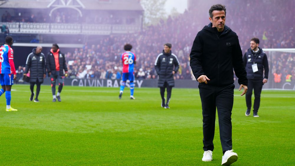 Marco Silva walks across the Cottage pitch ahead of Fulham's match against Crystal Palace