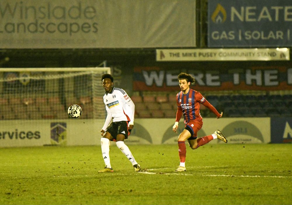 Eddy Nsasi passes the ball for Fulham U21s against Aldershot Town