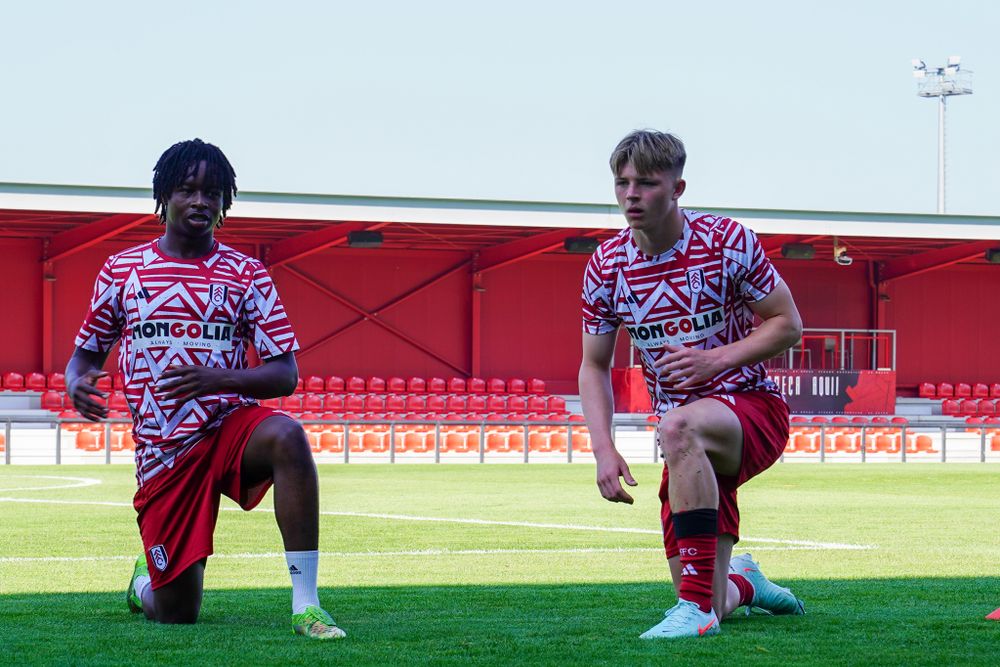 Chibby Nwoko and Logan Cooke warm up ahead of the Braga B game