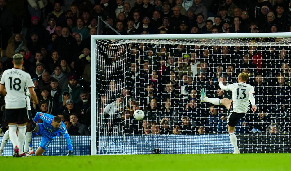 Tim Ream clears the ball from near the line